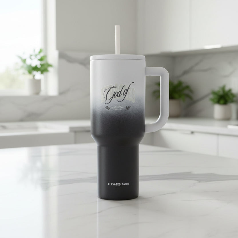 Black and gray tumbler with 'God of' text on a white background