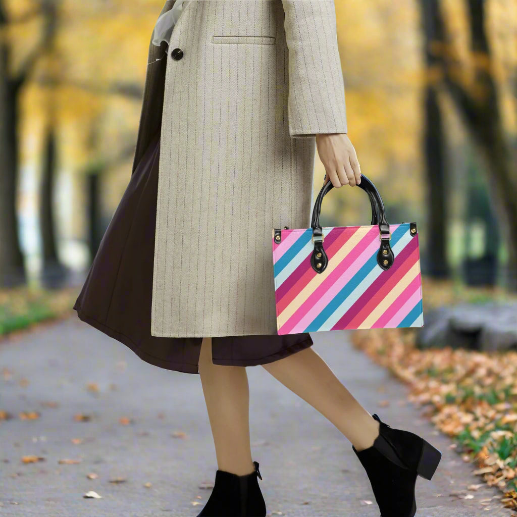 Rainbow Stripe PU Leather Handbag - Kim’s Signature Beauty & Accessories (Store description)