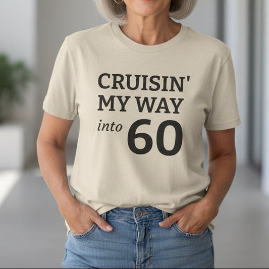 Beige t-shirt with text 'Cruisin' My Way into 60' on a white background