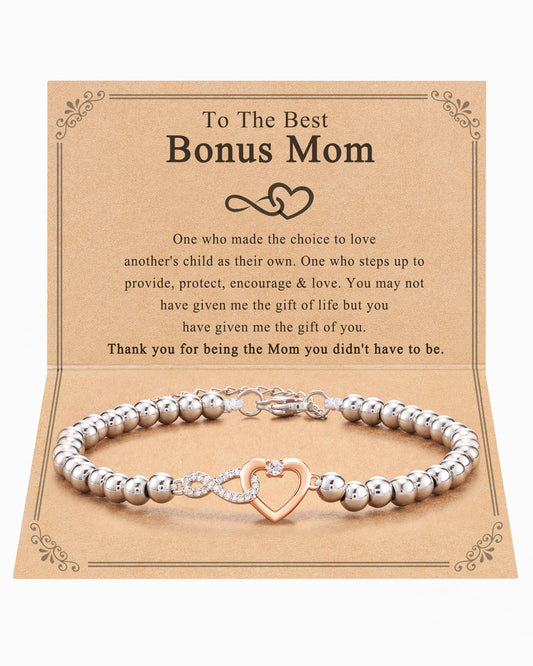 Silver beaded bracelet with heart charm on a decorative card for 'Best Bonus Mom'.