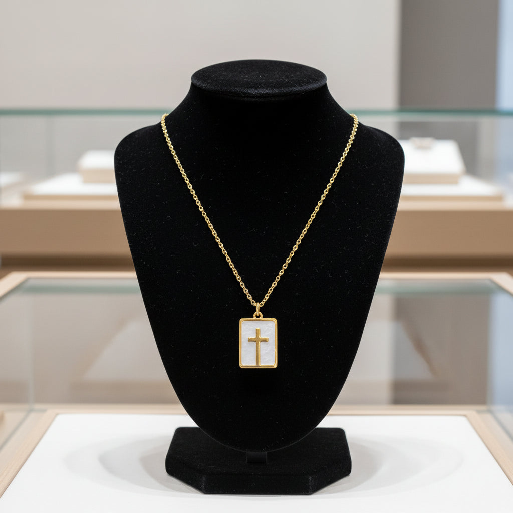 Necklace with a gold cross pendant on a white background