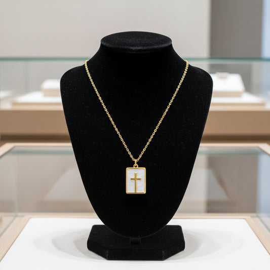 Necklace with a gold cross pendant on a white background