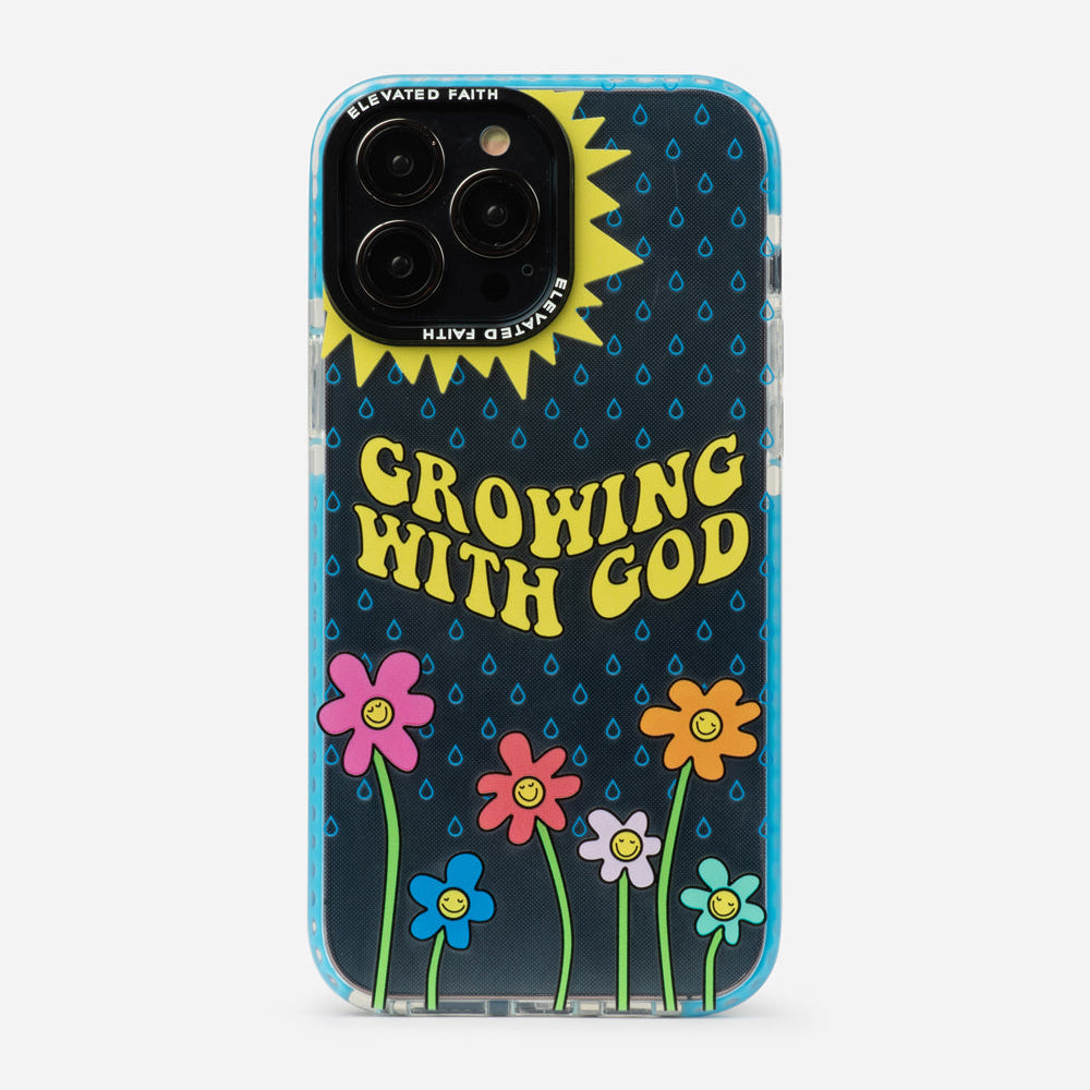 Phone case with 'Growing with God' text and colorful flowers on a black background
