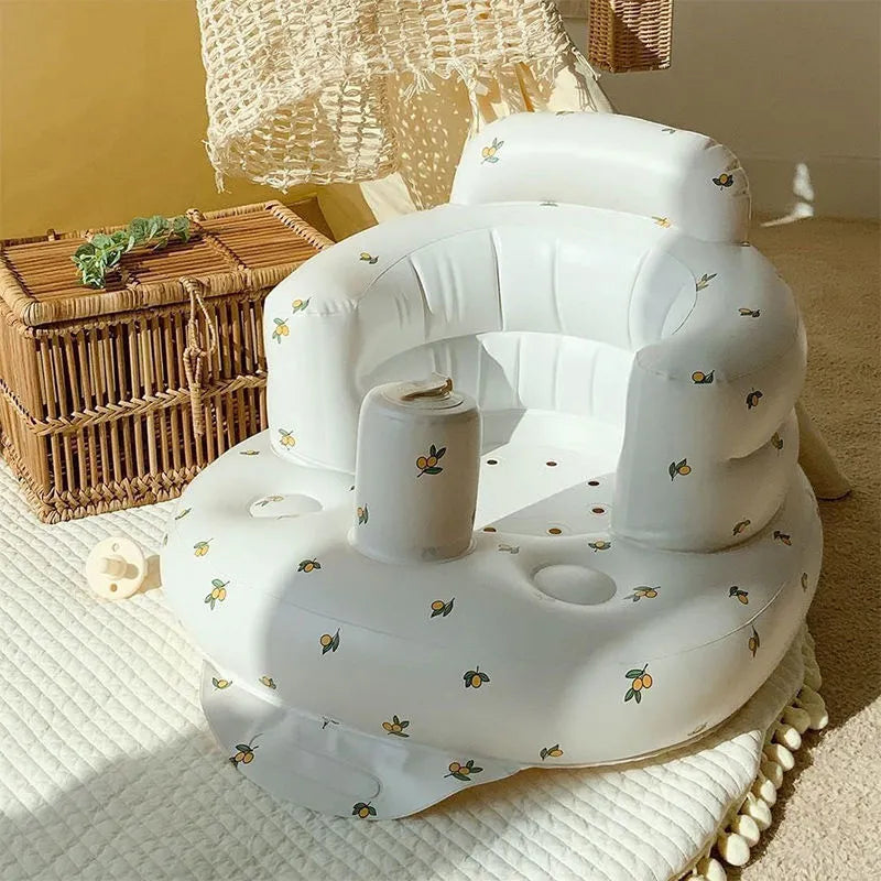 White inflatable chair with floral patterns on a textured surface