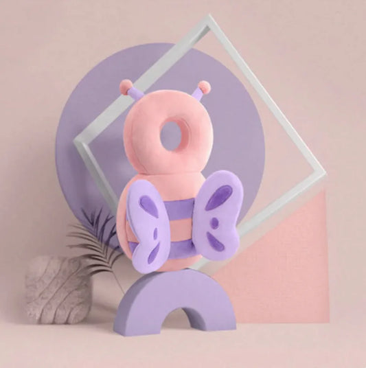 Pink and purple butterfly-shaped toy on a geometric background