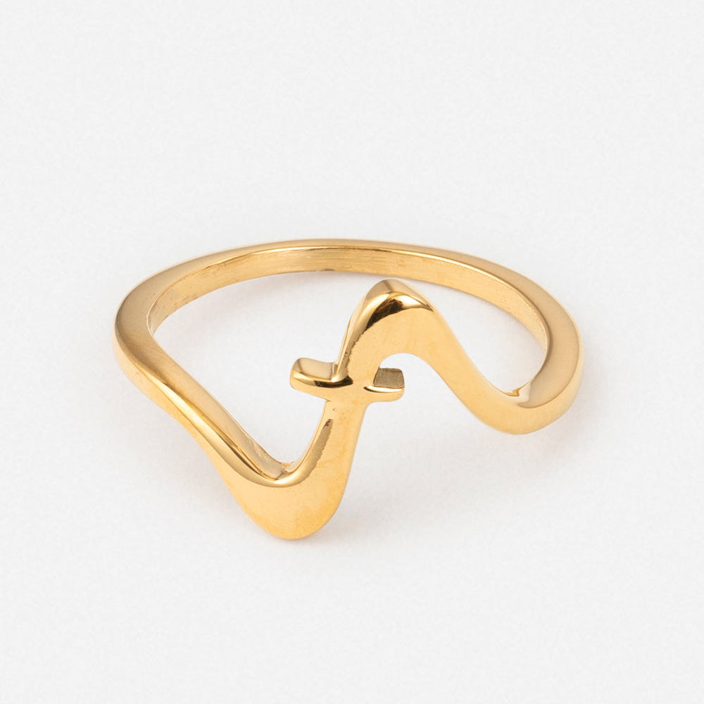 Gold ring with a wavy design on a white background