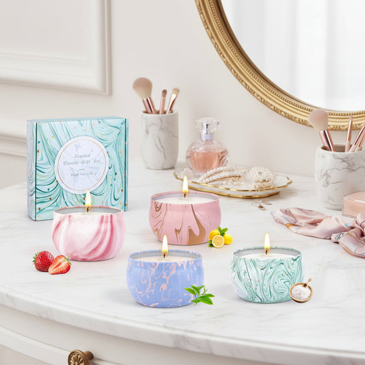 Marble-patterned candles with a gift box and decorative elements.