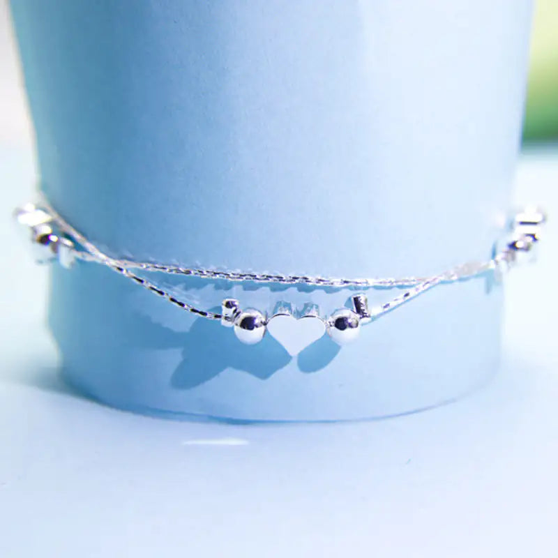 Double Layered Heart Bracelet - Kim’s Signature Beauty & Accessories    (Store description)